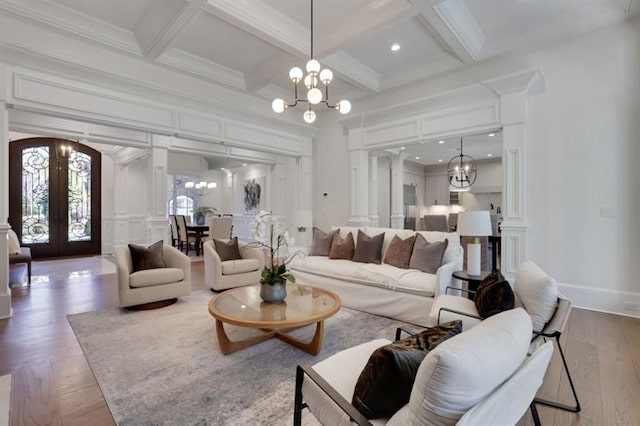 821 Camden Park Ct, Atlanta, GA 30342 - living room featuring a chandelier, french doors, beam ceiling, coffered ceiling, and ornamental molding