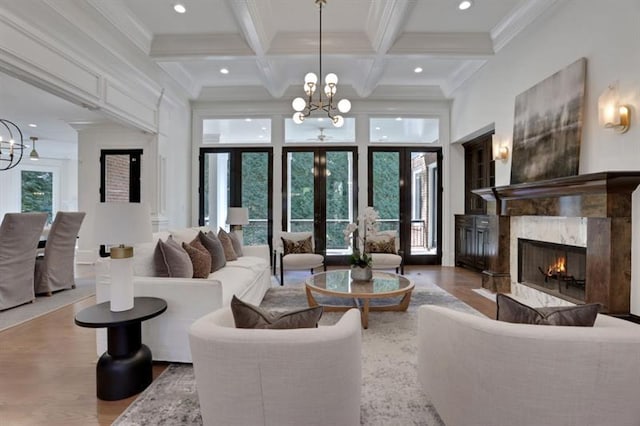 821 Camden Park Ct, Atlanta, GA 30342 - living area with a chandelier, wood finished floors, beam ceiling, coffered ceiling, and a fireplace