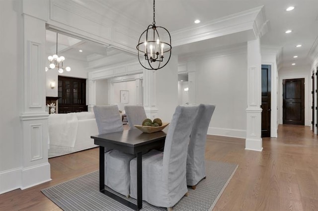 821 Camden Park Ct, Atlanta, GA 30342 - dining space with a chandelier, ornamental molding, wood finished floors, ornate columns, and recessed lighting