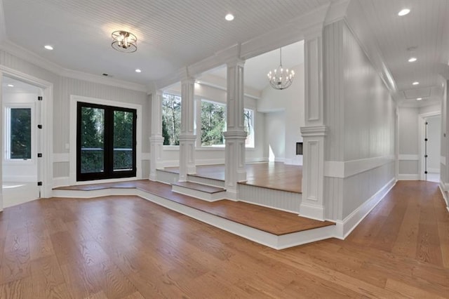 821 Camden Park Ct, Atlanta, GA 30342 - entryway featuring a decorative wall, wood finished floors, plenty of natural light, crown molding, and decorative columns