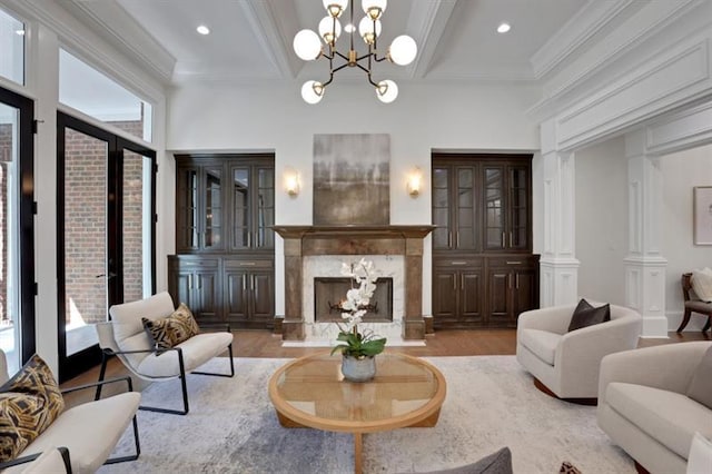 821 Camden Park Ct, Atlanta, GA 30342 - living room with a premium fireplace, wood finished floors, beamed ceiling, a chandelier, and ornamental molding