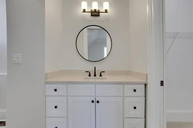 821 Camden Park Ct, Atlanta, GA 30342 - bathroom with vanity and a walk in closet