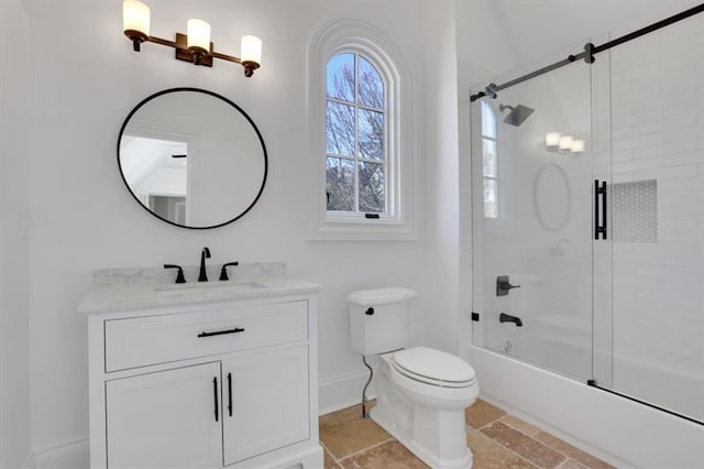 821 Camden Park Ct, Atlanta, GA 30342 - full bathroom featuring vanity, bath / shower combo with glass door, and stone finish floors