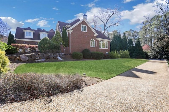 821 Camden Park Ct, Atlanta, GA 30342 - view of property exterior featuring a yard, a chimney, and brick siding