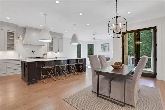 821 Camden Park Ct, Atlanta, GA 30342 - dining room with recessed lighting, french doors, light wood finished floors, a chandelier, and crown molding