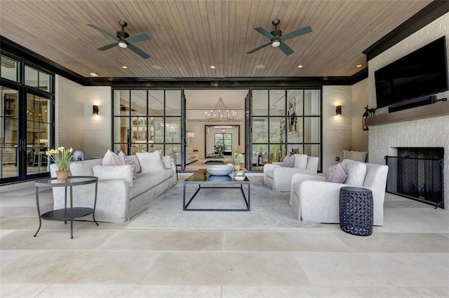 living room featuring ceiling fan, a wall of windows, and wood ceiling