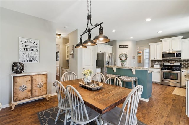 dining area with dark wood-type flooring