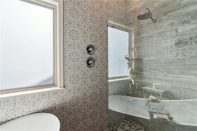 bathroom with a tile shower