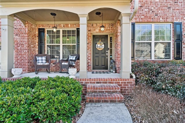 doorway to property featuring covered porch