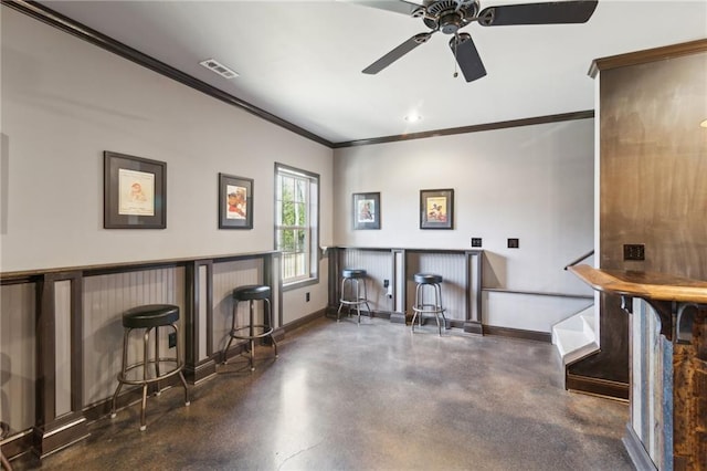 interior space with ornamental molding and bar