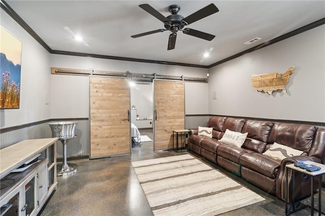 living room featuring ornamental molding, a barn door, and ceiling fan