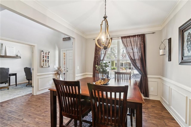 dining area featuring crown molding and dark hardwood / wood-style flooring