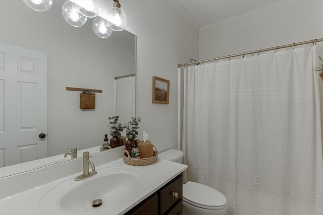 bathroom featuring toilet, crown molding, and vanity