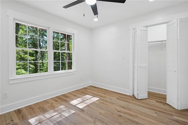 4745 Elam Forest Dr, Stone Mountain, GA 30083 - unfurnished bedroom with baseboards, light wood-type flooring, a closet, a ceiling fan, and recessed lighting