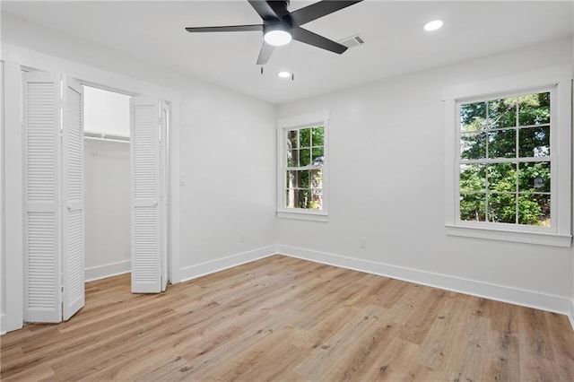 4745 Elam Forest Dr, Stone Mountain, GA 30083 - unfurnished bedroom with baseboards, light wood-type flooring, recessed lighting, a ceiling fan, and a closet
