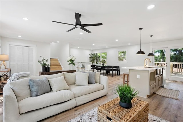4745 Elam Forest Dr, Stone Mountain, GA 30083 - living area with light wood-type flooring, recessed lighting, ceiling fan, stairway, and french doors