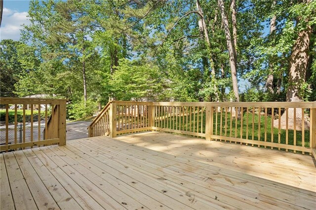 4745 Elam Forest Dr, Stone Mountain, GA 30083 - wooden terrace featuring view of wooded area