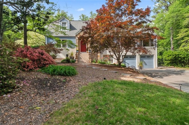 view of front facade featuring driveway and an attached garage