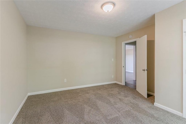 545 Fayetteville Rd, Fairburn, GA 30213 - unfurnished room with carpet flooring, a textured ceiling, and baseboards