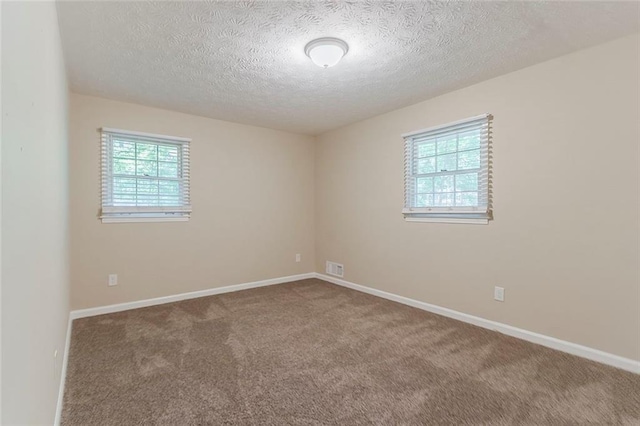 545 Fayetteville Rd, Fairburn, GA 30213 - unfurnished room with a textured ceiling, carpet floors, and baseboards