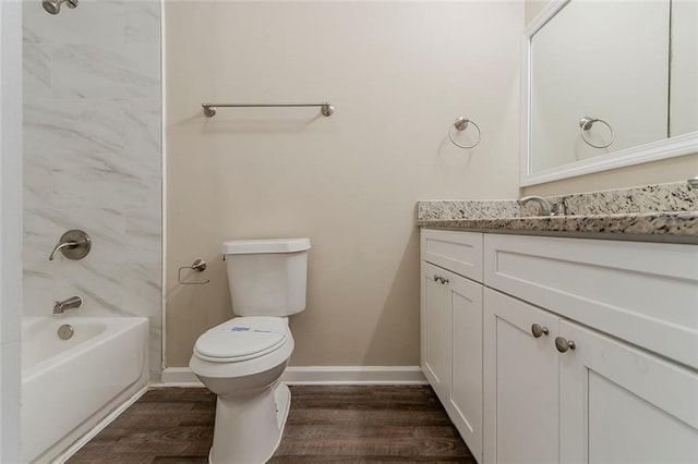 545 Fayetteville Rd, Fairburn, GA 30213 - bathroom featuring toilet, vanity, wood finished floors, shower / bath combination, and baseboards