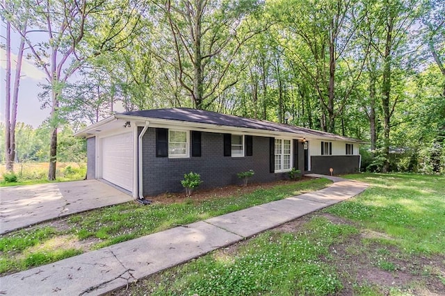 545 Fayetteville Rd, Fairburn, GA 30213 - ranch-style home with concrete driveway, brick siding, a front lawn, and an attached garage