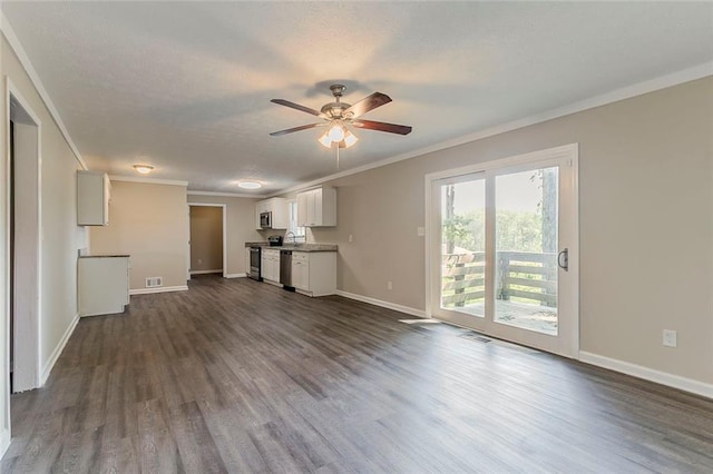 545 Fayetteville Rd, Fairburn, GA 30213 - unfurnished living room with dark wood-style floors, a ceiling fan, crown molding, baseboards, and a sink