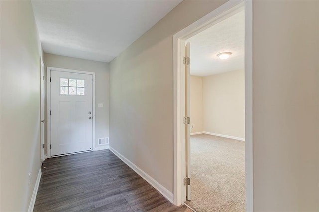 545 Fayetteville Rd, Fairburn, GA 30213 - doorway to outside featuring baseboards and dark wood-style flooring