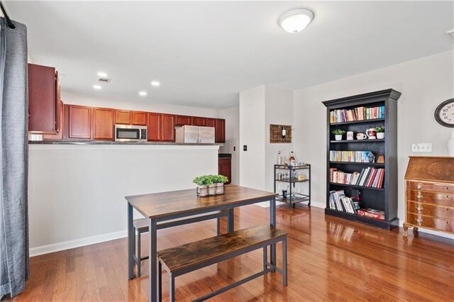 dining room featuring wood-type flooring