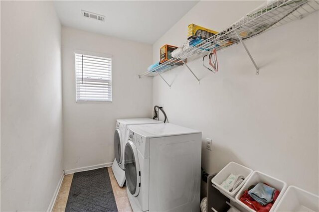 laundry room featuring separate washer and dryer