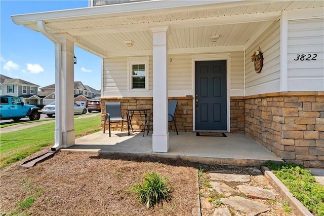 doorway to property with covered porch