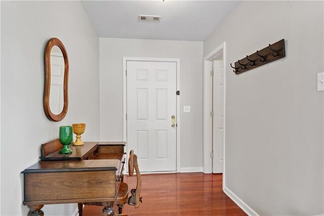 interior space with dark hardwood / wood-style floors