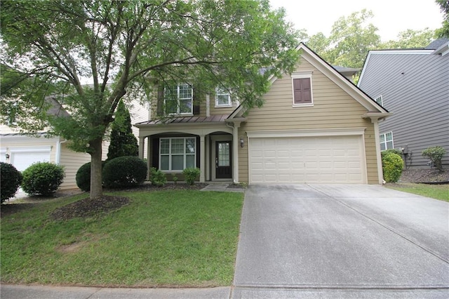 942 Idlewood Dr, Canton, GA 30115 - traditional-style house featuring concrete driveway, a standing seam roof, a front yard, a garage, and metal roof
