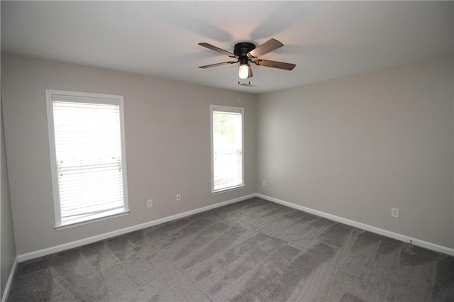 942 Idlewood Dr, Canton, GA 30115 - spare room featuring baseboards, a ceiling fan, and dark carpet