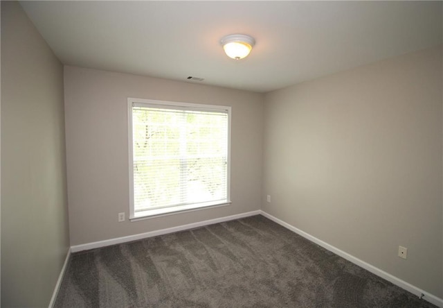942 Idlewood Dr, Canton, GA 30115 - spare room featuring dark colored carpet and baseboards