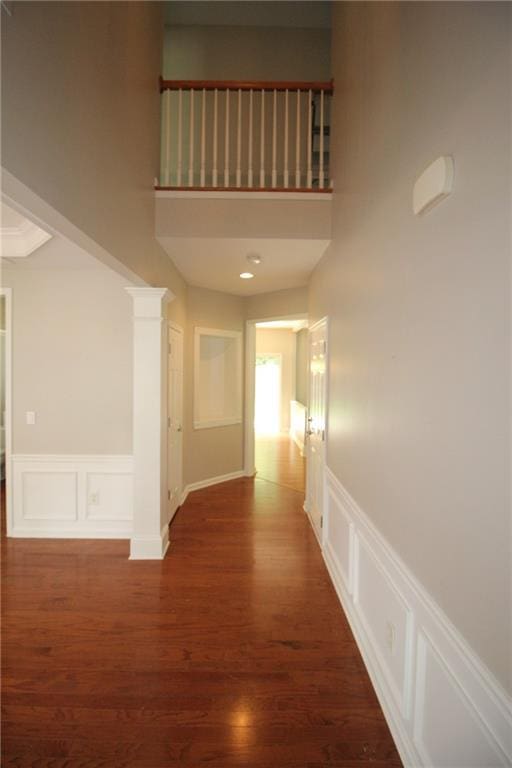 942 Idlewood Dr, Canton, GA 30115 - hall with wood finished floors, wainscoting, a decorative wall, and a high ceiling
