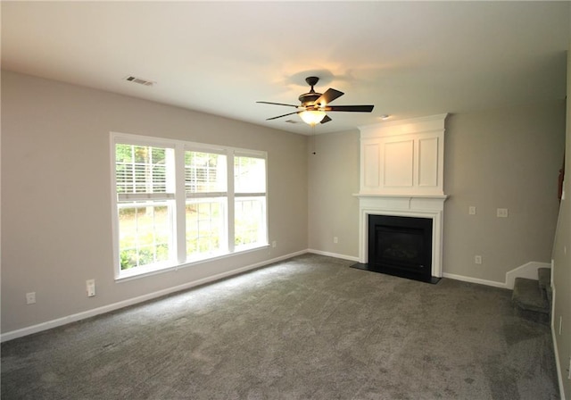 942 Idlewood Dr, Canton, GA 30115 - unfurnished living room featuring baseboards, dark colored carpet, a ceiling fan, and a large fireplace