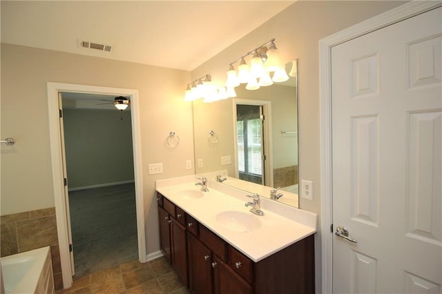 942 Idlewood Dr, Canton, GA 30115 - bathroom with double vanity, a bath, a ceiling fan, and baseboards