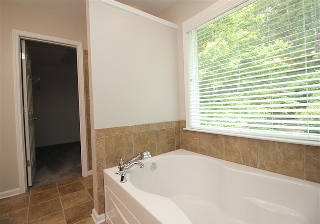 942 Idlewood Dr, Canton, GA 30115 - bathroom featuring a bath and tile patterned floors