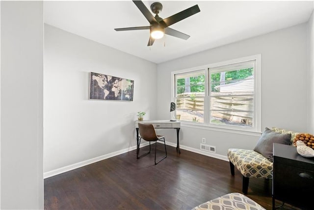 home office with dark hardwood / wood-style floors and ceiling fan