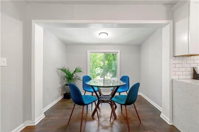 dining area with dark wood-type flooring