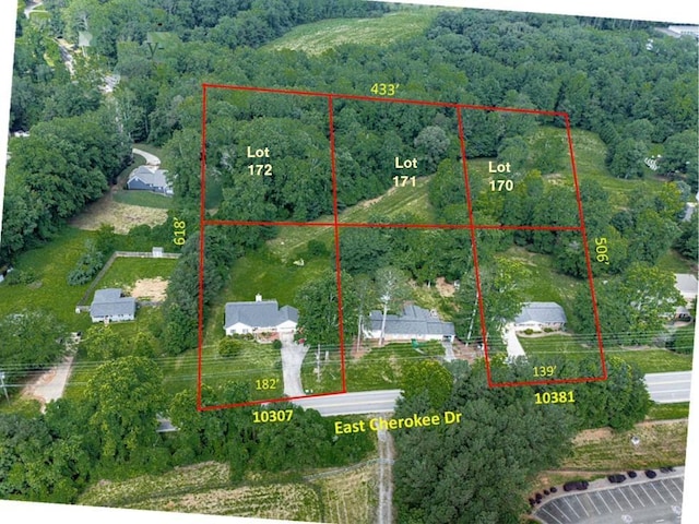 10307 E Cherokee Dr, Canton, GA 30115 - aerial view of property and surrounding area with a heavily wooded area and property parcel outlined