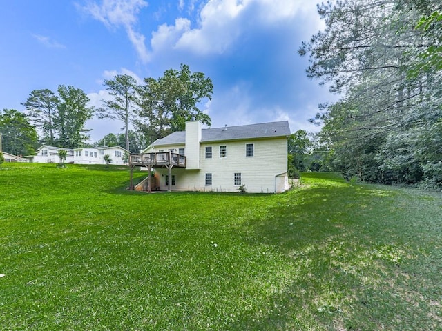 10307 E Cherokee Dr, Canton, GA 30115 - back of house with a wooden deck, a yard, and a chimney
