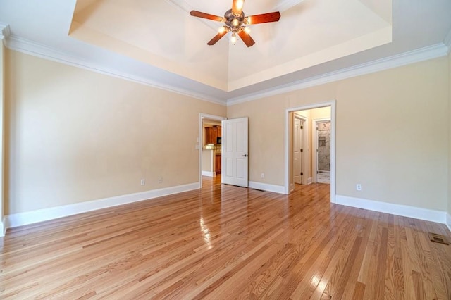 980 Windsor Place Cir, Grayson, GA 30017 - unfurnished bedroom featuring a raised ceiling, light wood-style floors, crown molding, baseboards, and ceiling fan