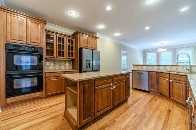 980 Windsor Place Cir, Grayson, GA 30017 - kitchen featuring refrigerator with ice dispenser, dishwasher, a sink, ornamental molding, and tasteful backsplash