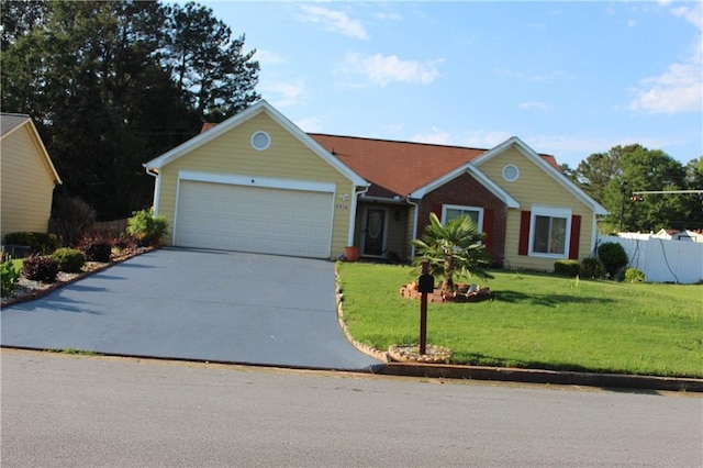 5574 Mccrossin Cir, Lithonia, GA 30038 - view of front of home featuring driveway and an attached garage