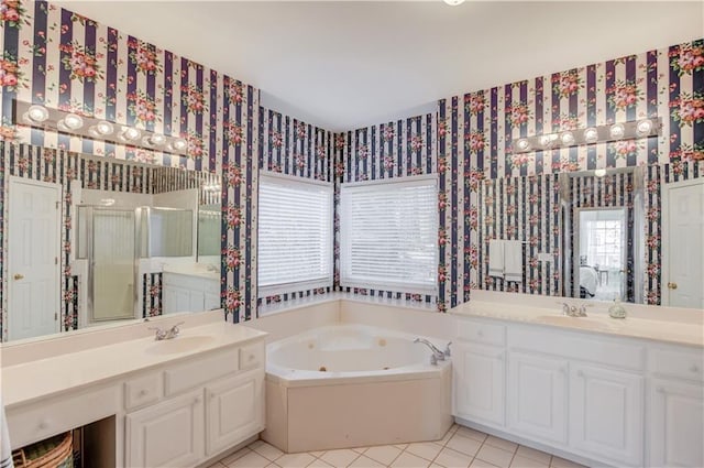 bathroom with tile patterned floors, vanity, and plus walk in shower