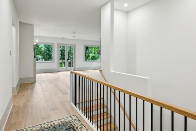 2760 Fraser St SE, Smyrna, GA 30080 - hall featuring an upstairs landing, wood finished floors, healthy amount of natural light, french doors, and recessed lighting