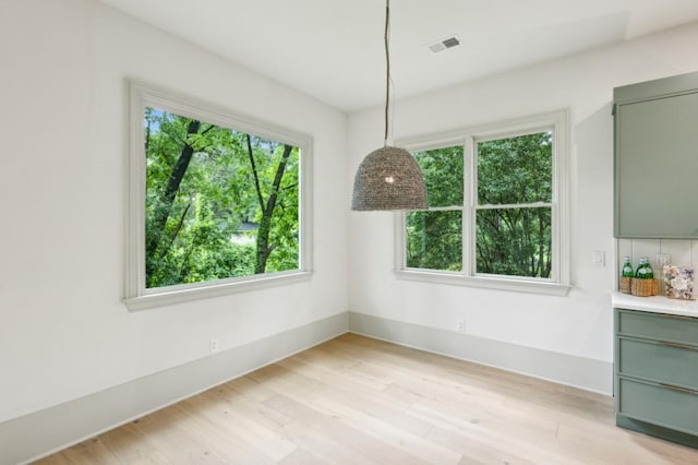 2760 Fraser St SE, Smyrna, GA 30080 - unfurnished dining area featuring light wood-type flooring and baseboards