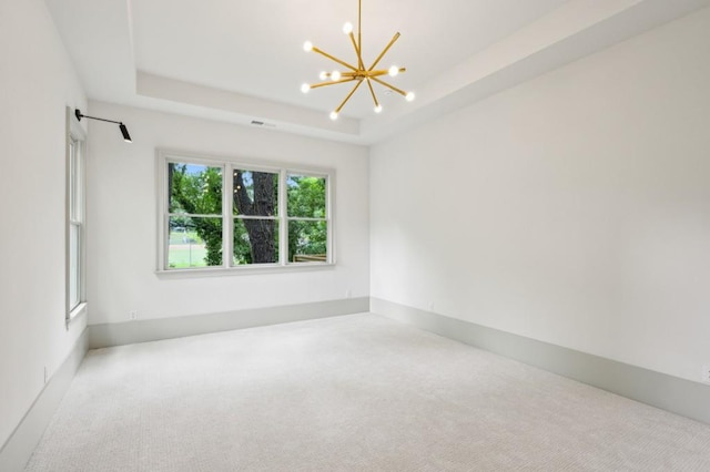 2760 Fraser St SE, Smyrna, GA 30080 - carpeted spare room with a chandelier and a raised ceiling